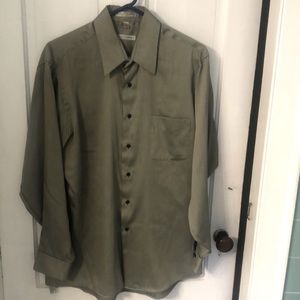 Geoffrey Beene button down shirt in olive green sateen fabric.  Left pocket.